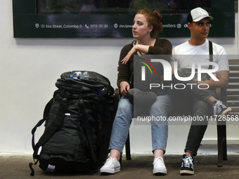 A group of tourists waits for the train at Colombo railway station in Colombo, Sri Lanka, on November 1, 2024. The tourism sector shows rema...