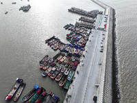 A large number of fishing boats berth in the harbor to take shelter from Typhoon Kong-Rey at the Liandao Central fishing port in Lianyungang...