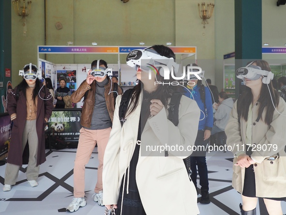 Visitors experience VR viewing at the 2024 Beijing International Cultural and Travel Consumer Expo at the Beijing Exhibition Center in Beiji...