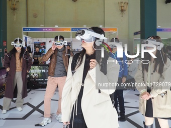 Visitors experience VR viewing at the 2024 Beijing International Cultural and Travel Consumer Expo at the Beijing Exhibition Center in Beiji...