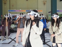 Visitors experience VR viewing at the 2024 Beijing International Cultural and Travel Consumer Expo at the Beijing Exhibition Center in Beiji...