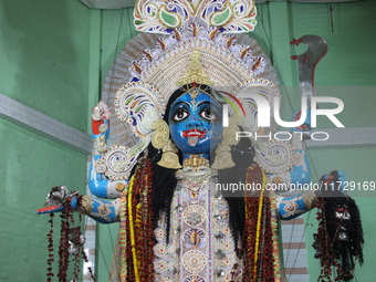 A clay idol of the Hindu goddess Kali is inside a ''pandal'' (a temporary platform), a decorated structure, on the occasion of the Kali Puja...