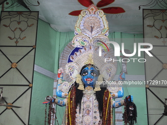 A clay idol of the Hindu goddess Kali is inside a ''pandal'' (a temporary platform), a decorated structure, on the occasion of the Kali Puja...