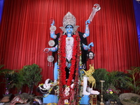 A clay idol of the Hindu goddess Kali is inside a ''pandal'' (a temporary platform), a decorated structure, on the occasion of the Kali Puja...