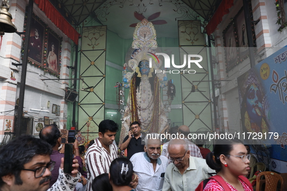 People visit a pandal, a decorated structure, during the celebration of the Hindu festival of Kali Puja in Kolkata, India, on November 1, 20...