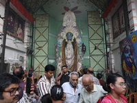 People visit a pandal, a decorated structure, during the celebration of the Hindu festival of Kali Puja in Kolkata, India, on November 1, 20...