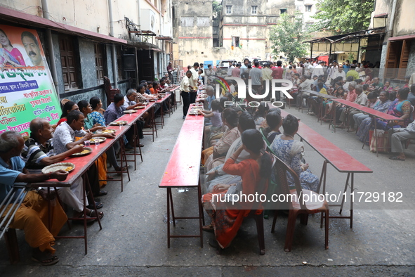 Devotees have offerings after worshiping the Hindu goddess Kali outside a ''pandal,'' a decorated temporary platform, on the occasion of the...