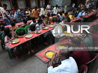 Devotees have offerings after worshiping the Hindu goddess Kali outside a ''pandal,'' a decorated temporary platform, on the occasion of the...