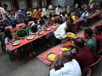 Devotees have offerings after worshiping the Hindu goddess Kali outside a ''pandal,'' a decorated temporary platform, on the occasion of the...