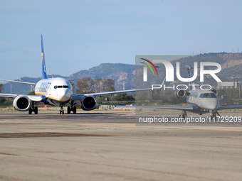 An Embraer Phenom 300 from Padaviation company is on the runway ready to take off from Barcelona airport in Barcelona, Spain, on October 8,...