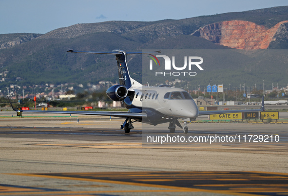 An Embraer Phenom 300 from Padaviation company is on the runway ready to take off from Barcelona airport in Barcelona, Spain, on October 8,...