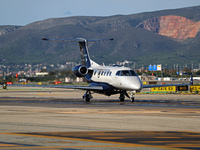 An Embraer Phenom 300 from Padaviation company is on the runway ready to take off from Barcelona airport in Barcelona, Spain, on October 8,...