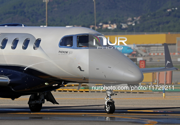 An Embraer Phenom 300 from Padaviation company is on the runway ready to take off from Barcelona airport in Barcelona, Spain, on October 8,...