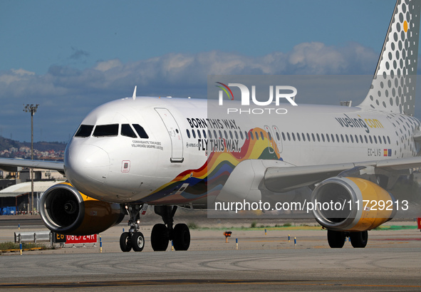 An Airbus A320-232 from Vueling, featuring the ''Born This Way, Fly This Way'' livery, is on the runway after landing at Barcelona El Prat A...