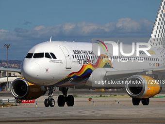 An Airbus A320-232 from Vueling, featuring the ''Born This Way, Fly This Way'' livery, is on the runway after landing at Barcelona El Prat A...