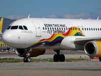 An Airbus A320-232 from Vueling, featuring the ''Born This Way, Fly This Way'' livery, is on the runway after landing at Barcelona El Prat A...