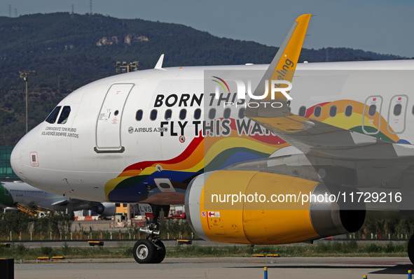 An Airbus A320-232 from Vueling, featuring the ''Born This Way, Fly This Way'' livery, is on the runway after landing at Barcelona El Prat A...