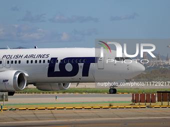 A Boeing 737 MAX 8 from LOT is on the runway after landing at Barcelona El Prat Airport in Barcelona, Spain, on October 8, 2024. (