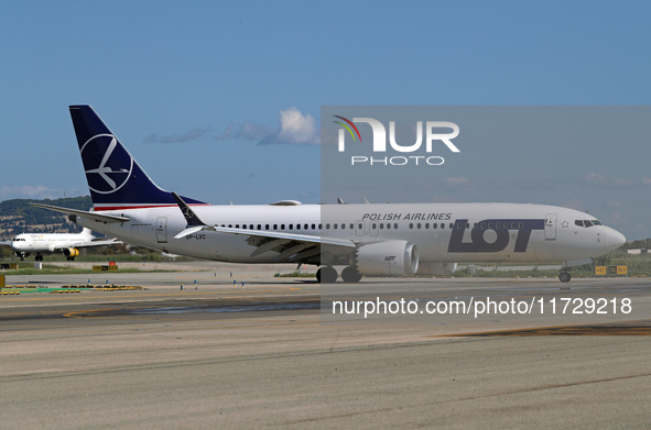 A Boeing 737 MAX 8 from LOT is on the runway after landing at Barcelona El Prat Airport in Barcelona, Spain, on October 8, 2024. 