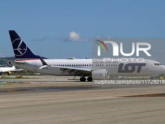 A Boeing 737 MAX 8 from LOT is on the runway after landing at Barcelona El Prat Airport in Barcelona, Spain, on October 8, 2024. (