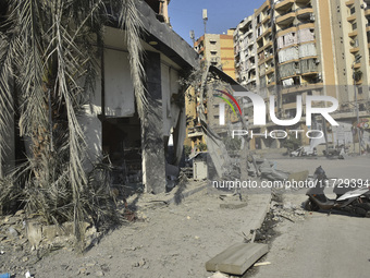 Firefighters extinguish the blaze at the site of overnight Israeli airstrikes that target the neighborhood of Kafaat in Beirut's southern su...