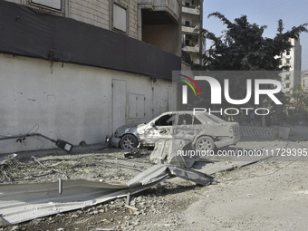 Firefighters extinguish the blaze at the site of overnight Israeli airstrikes that target the neighborhood of Kafaat in Beirut's southern su...