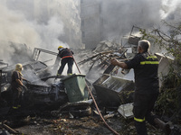 Firefighters extinguish the blaze at the site of overnight Israeli airstrikes that target the neighborhood of Kafaat in Beirut's southern su...