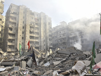 Firefighters extinguish the blaze at the site of overnight Israeli airstrikes that target the neighborhood of Kafaat in Beirut's southern su...