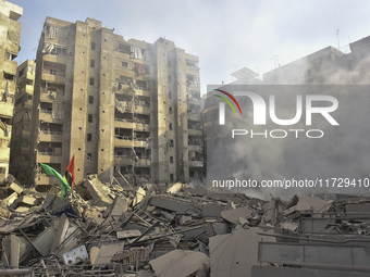 Firefighters extinguish the blaze at the site of overnight Israeli airstrikes that target the neighborhood of Kafaat in Beirut's southern su...