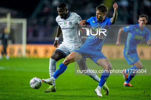 Marcus Thuram of FC Internazionale and Mattia Viti of Empoli FC during the Serie A Enilive match between Empoli FC and FC Internazionale at...