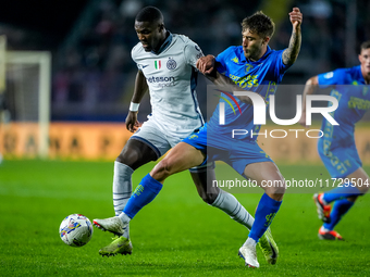 Marcus Thuram of FC Internazionale and Mattia Viti of Empoli FC during the Serie A Enilive match between Empoli FC and FC Internazionale at...