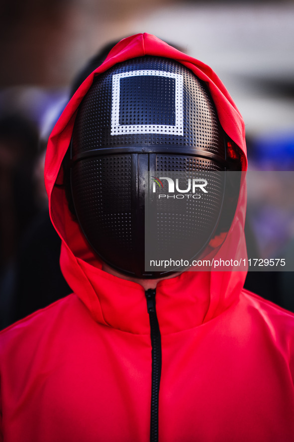 A cosplayer attends the photocall for the press conference of Netflix's Squid Game Season 2 at Lucca Comics & Games in Lucca, Italy, on Octo...