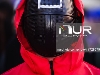 A cosplayer attends the photocall for the press conference of Netflix's Squid Game Season 2 at Lucca Comics & Games in Lucca, Italy, on Octo...