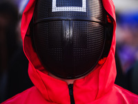 A cosplayer attends the photocall for the press conference of Netflix's Squid Game Season 2 at Lucca Comics & Games in Lucca, Italy, on Octo...