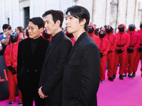 Hwang Dong-hyuk, Lee Jung-jae, and Wi Ha-joon attend the photocall for the press conference of Netflix's Squid Game Season 2 at Lucca Comics...