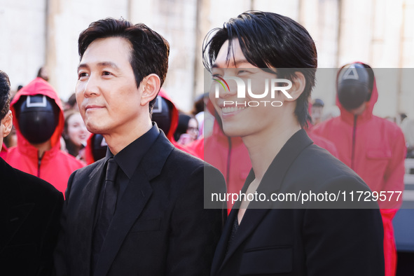 Lee Jung-jae and Wi Ha-joon attend the photocall for the press conference of Netflix's Squid Game Season 2 at Lucca Comics & Games in Lucca,...