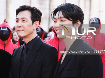 Lee Jung-jae and Wi Ha-joon attend the photocall for the press conference of Netflix's Squid Game Season 2 at Lucca Comics & Games in Lucca,...