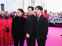 Hwang Dong-hyuk, Lee Jung-jae, and Wi Ha-joon attend the photocall for the press conference of Netflix's Squid Game Season 2 at Lucca Comics...