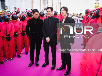 Hwang Dong-hyuk, Lee Jung-jae, and Wi Ha-joon attend the photocall for the press conference of Netflix's Squid Game Season 2 at Lucca Comics...