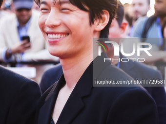 Wi Ha-joon attends the photocall for the press conference of Netflix's Squid Game Season 2 at Lucca Comics & Games in Lucca, Italy, on Octob...