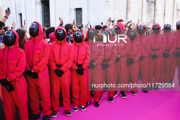 A cosplayer attends the photocall for the press conference of Netflix's Squid Game Season 2 at Lucca Comics & Games in Lucca, Italy, on Octo...