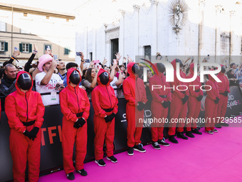 A cosplayer attends the photocall for the press conference of Netflix's Squid Game Season 2 at Lucca Comics & Games in Lucca, Italy, on Octo...