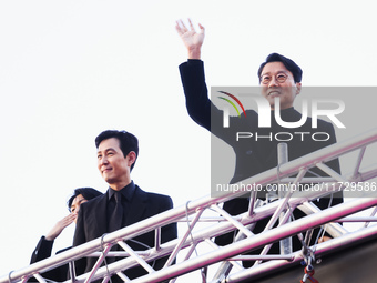 Lee Jung-jae and Hwang Dong-hyuk attend the photocall for the press conference of Netflix's Squid Game Season 2 at Lucca Comics & Games in L...