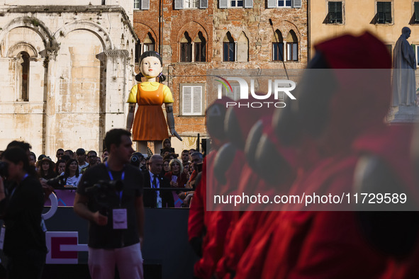 A cosplayer attends the photocall for the press conference of Netflix's Squid Game Season 2 at Lucca Comics & Games in Lucca, Italy, on Octo...