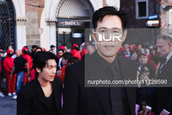 Lee Jung-jae and Wi Ha-joon attend the photocall for the press conference of Netflix's Squid Game Season 2 at Lucca Comics & Games in Lucca,...