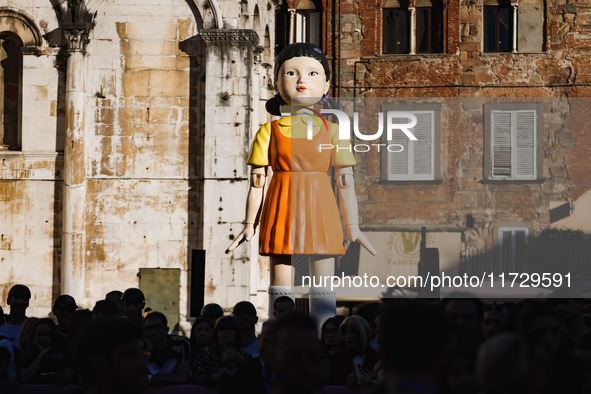 A cosplayer attends the photocall for the press conference of Netflix's Squid Game Season 2 at Lucca Comics & Games in Lucca, Italy, on Octo...