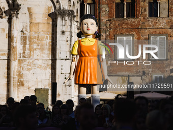 A cosplayer attends the photocall for the press conference of Netflix's Squid Game Season 2 at Lucca Comics & Games in Lucca, Italy, on Octo...