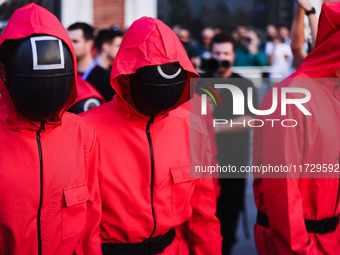 A cosplayer attends the photocall for the press conference of Netflix's Squid Game Season 2 at Lucca Comics & Games in Lucca, Italy, on Octo...