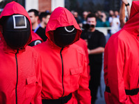 A cosplayer attends the photocall for the press conference of Netflix's Squid Game Season 2 at Lucca Comics & Games in Lucca, Italy, on Octo...