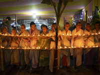 Elderly women at Pramod Talukdar Memorial Old Age Home light Diya oil lamps as they celebrate Diwali in Guwahati, India, on November 1, 2024...